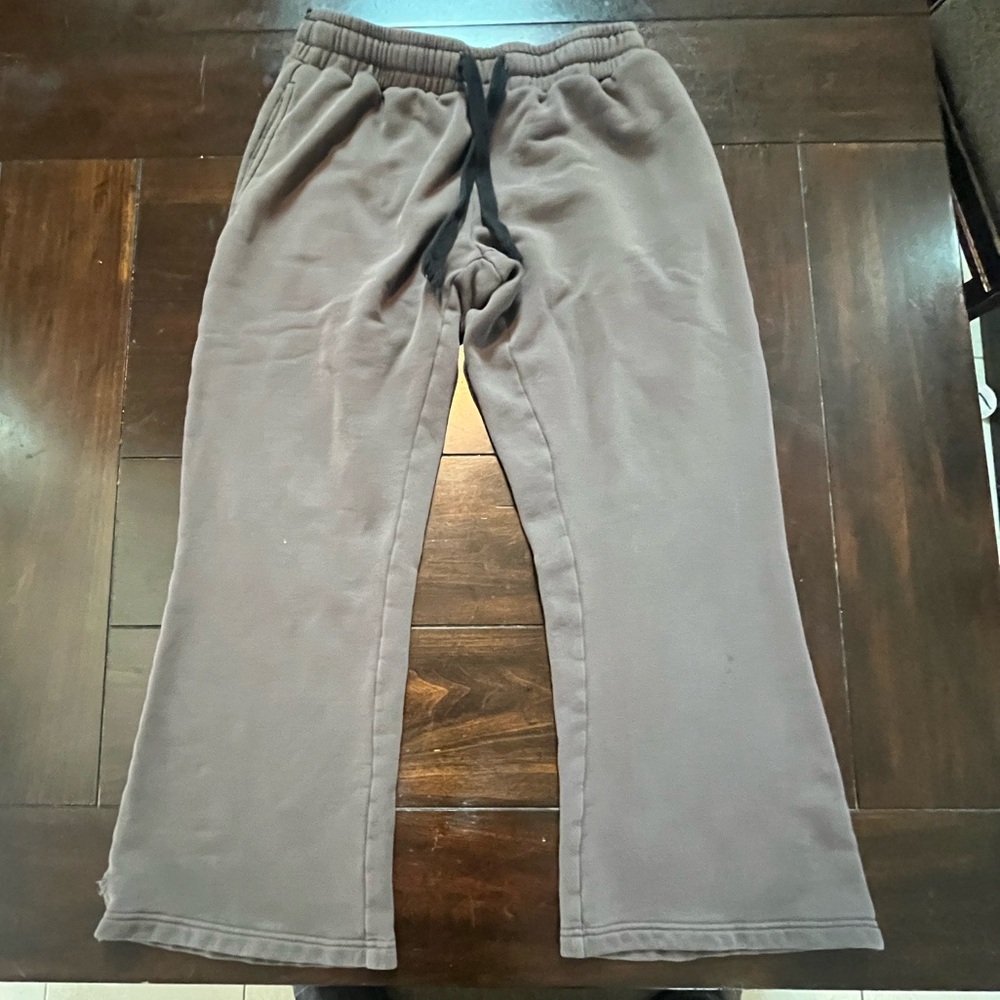 Grey and black flared sweatpants.